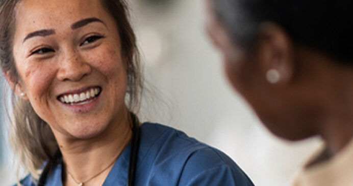 A care team member with a patient at a rural hospital